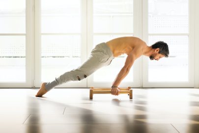 Athletic man doing a calisthenics planche pose